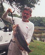 Fishing Biologist Roy Greer with a Lake Fork trophy bass.